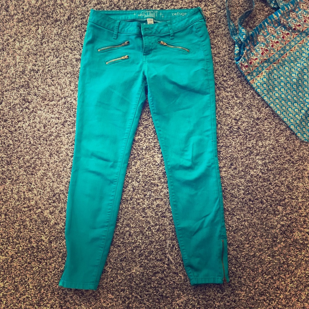 Refugee teal blue jeans